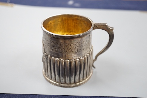 A George IV demi-fluted silver christening mug, with later engraved inscription, London, 1823, 69mm.
